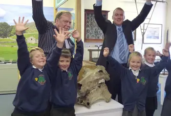 Pupils from Greatwood Primary School, Cllr Simon Myers and Paul Ellis (Director of Services) celebrate Craven Museum and Gallery first round pass