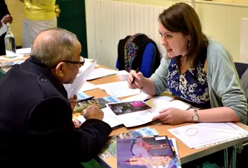 HLF staff member speaking to applicant at an event