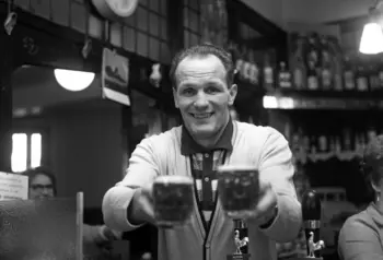 Henry Cooper behind the bar of The Fellowship Inn, South London in 1963