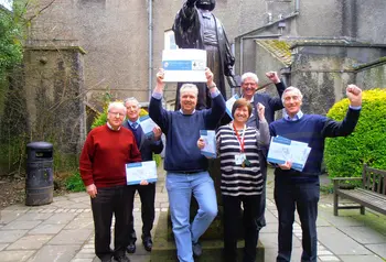 Staff and volunteers from the New Room celebrate the grant success