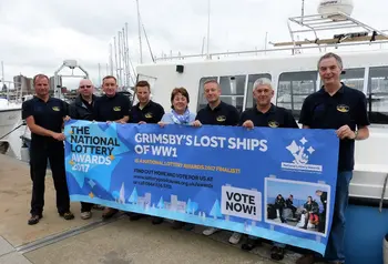 Linda Wood (centre), descendant of the captain of sunken trawler, Alberta, with the dive team