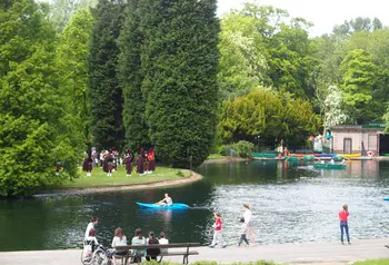 People enjoy the sun in Thompson Park, Burnley