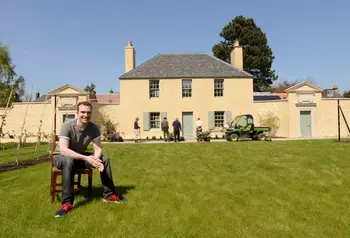 Sutherland Forsyth sitting in front of the Cottage