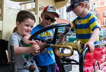 Children playing with one of the Battle Buses
