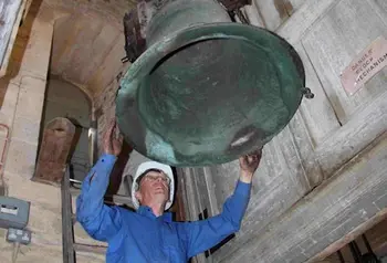 A volunteer restoring one of the bells at St Rumbald’s, Stoke Doyle 