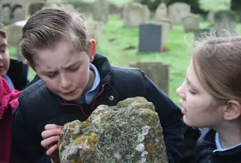 School children examining Tom’s alleged fingerprints