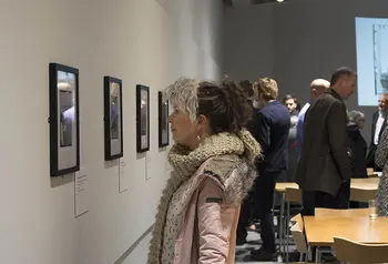 Visitors enjoy the opening of the exhibition