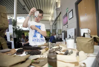Examining some First World War artefacts at a community workshop