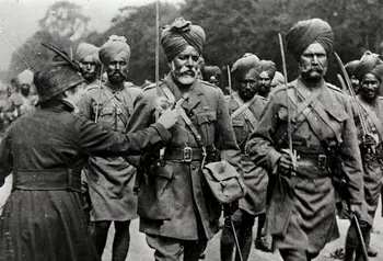 A lady pinning a flower on a Sikh soldier, 1916