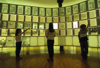 Children point to screens at the Lighthouse, Glasgow
