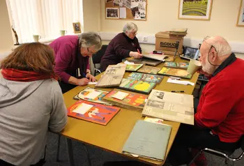 Participants logging archive materials