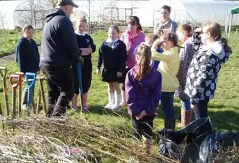 School children being taught about the importance of hedgerow