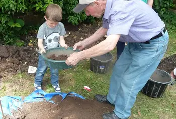 A child being shown the basics of archaeology
