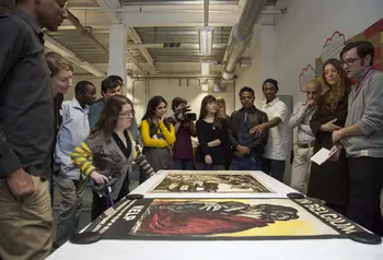 Participants discussing one of the exhibition items