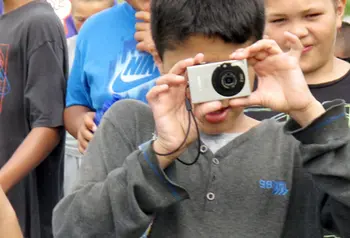 Young people taking photographs