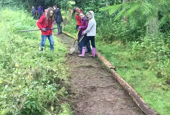 Young people clearing and maintaining paths