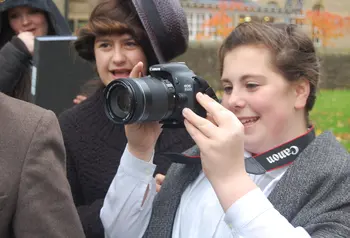 Young people making use of professional photography equipment