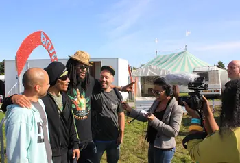 Young people interviewing for the radio station