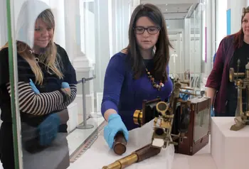 Young curator Bethany helping with an installation at the National Museums Scotland