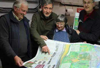 Volunteers from the Hadleigh and Thundersley Community Archive Group examine a walking map