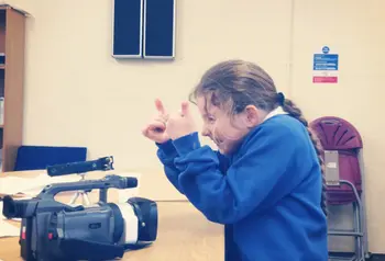 A young Traveller filming stories