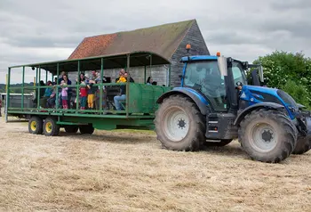 Visitors on the back of a tractor at Woodoaks Farm.
