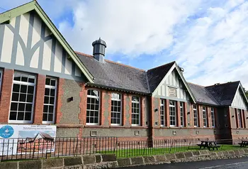 A restored nineteenth-century brick school building