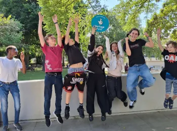 Young people jumping in the air celebrating their Heritage Fund grant to restore their Hall