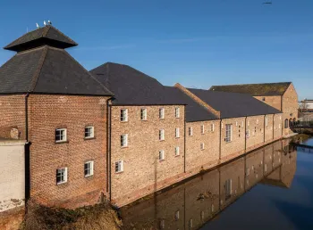 The historic buildings next to a body of water in Grimsby.