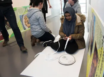 Young people working on the exhibition