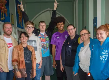 Group of people standing looking at camera