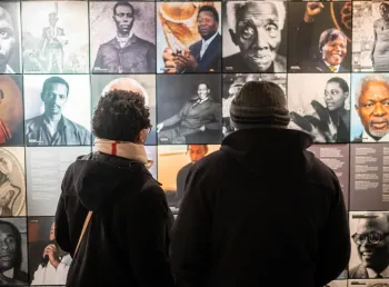 People viewing an exhibition at the International Slavery Museum