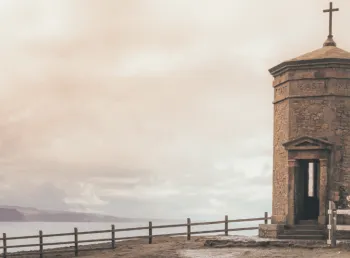 Octagonal brick structure with roof with a cross on the cliff tops above Bude in Cornwall.