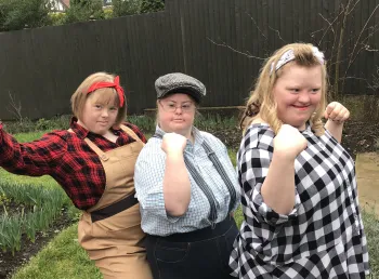 Three young people in war era clothing