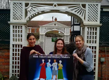 Women holding a sign