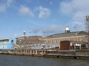 Dockside buildings under a blue sky