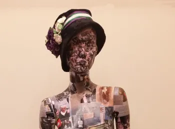 A mannequin covered in photos and documents. Volunteers created the 'Wo-Mannequin' from photos of the research, visits and materials they collected during the project