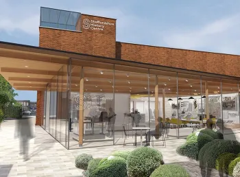 An artist's impression of a building with glass walls and a low wooden roof, with the words 'staffordshire history centre' on the side of the building