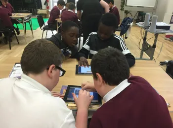 Young people developing graphic novels about history on ipads