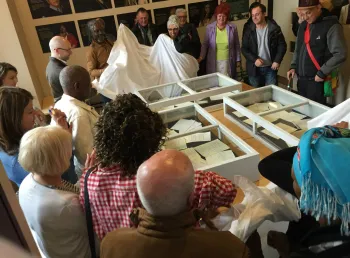 Participants looking at objects as part of the Great War to Race Riots