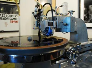 A vinyl record being cut