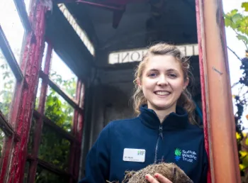 Ali North of Suffolk Wildlife Trust holds a hedgehog