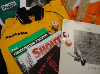 Archive materials including magazines, clothes and badges