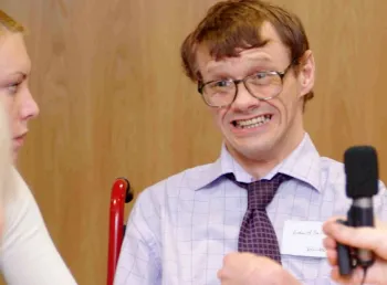 Disabled volunteers interviewing people with cerebral palsy