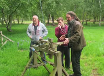Young people learning about traditional building methods