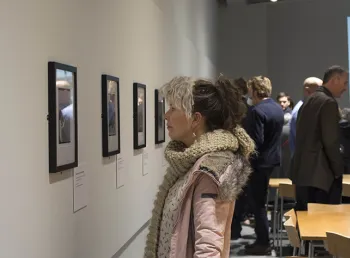 Visitors enjoy the opening of the exhibition