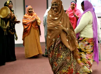 A group of people from Granby Somali Women's group stand in a circle