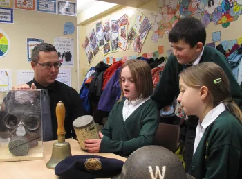 Children viewing First World War objects at a Green Howards Museum outreach event