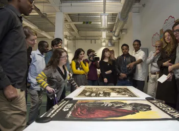 Participants discussing one of the exhibition items