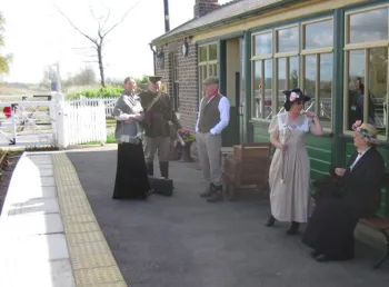 People in historic dress at Scruton Station